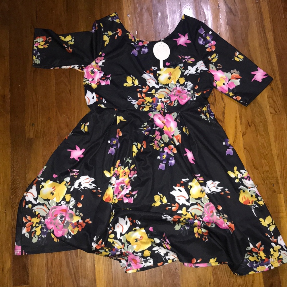 Black dress with festive colorful floral print.